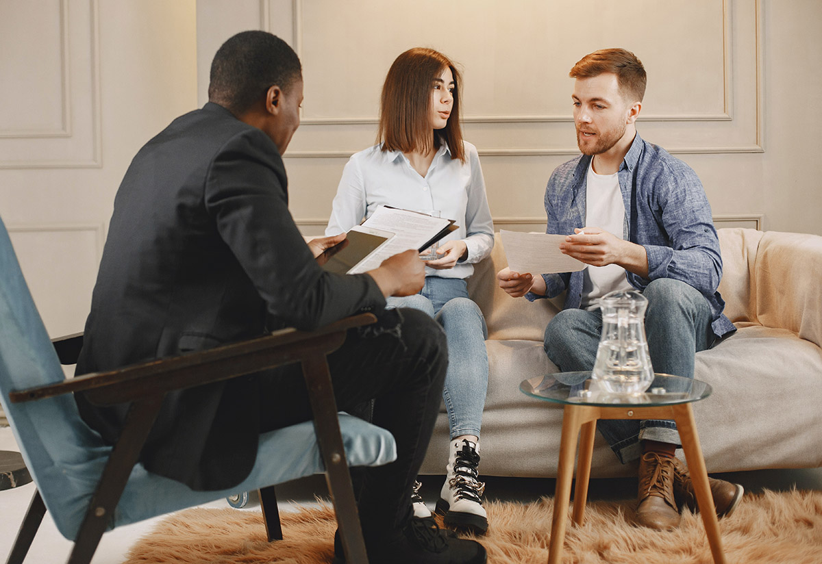 photo of a man, woman, and a counselor during a couples therapy session