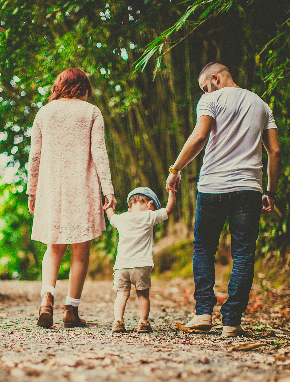 photo of a young family holding hands while working through Internal Family Systems