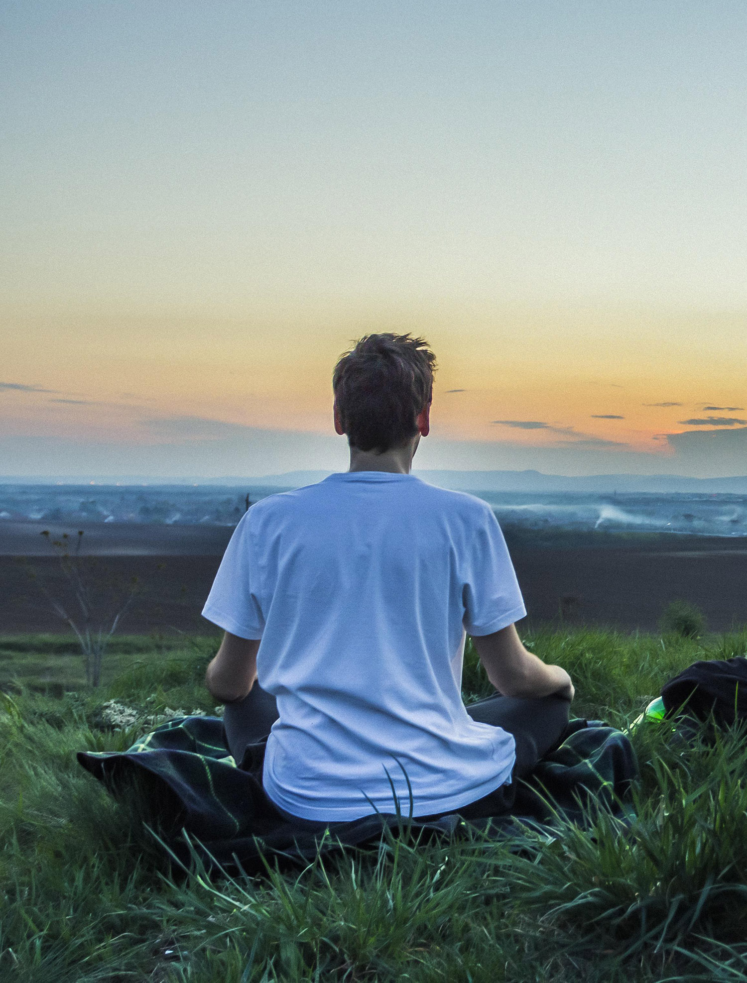 Photo of a man meditating as a result of dialectical behavior therapy