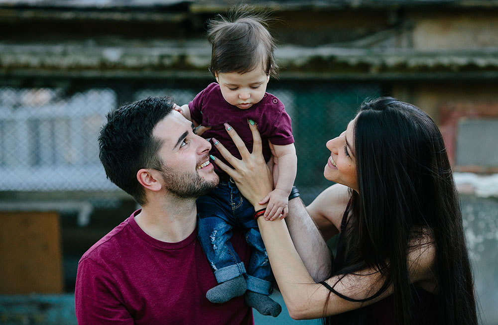 young family with a child on the nature Counseling